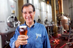 Samuel Adams founder says craft brewers face tough market, but ‘AI can’t brew beer’