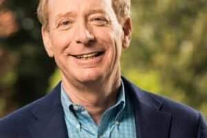 Microsoft President Brad Smith criticizes tech moguls’ AI warnings as hypocritical and self-serving